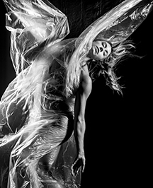 Woman in studio photo with wind in black and white